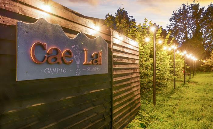 Cae Lal sign on the lawn with festoon lighting
